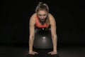 Beautiful young athletic woman exercising with a gymnastics ball Royalty Free Stock Photo