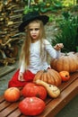 Beautiful young baby girl in witch costume outdoors. Royalty Free Stock Photo