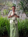 Beautiful Young Balinese Woman shows Bali Greeting