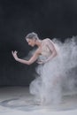 Beautiful young ballerina dancing in white flour Royalty Free Stock Photo