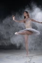 Beautiful young ballerina dancing in white flour Royalty Free Stock Photo