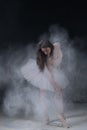 Beautiful young ballerina dancing in white flour Royalty Free Stock Photo