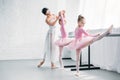 beautiful young ballet teacher exercising with kids Royalty Free Stock Photo