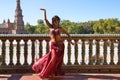 Beautiful young belly dancer is posing for the camera in a photo shoot. The woman is beautiful and dressed in traditional clothes Royalty Free Stock Photo