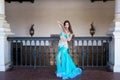 Beautiful young belly dancer is posing for the camera in a photo shoot. The woman is beautiful and dressed in traditional clothes Royalty Free Stock Photo