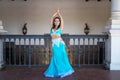 Beautiful young belly dancer is posing for the camera in a photo shoot. The woman is beautiful and dressed in traditional clothes Royalty Free Stock Photo