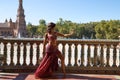 Beautiful young belly dancer is posing for the camera in a photo shoot. The woman is beautiful and dressed in traditional clothes Royalty Free Stock Photo