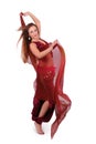 Beautiful young belly dancer with a veil