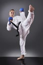 Beautiful young black belt female karate doing kick Royalty Free Stock Photo