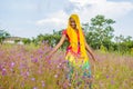 beautiful young black girl having a fun time in a field of purple flowers Royalty Free Stock Photo