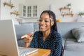 Beautiful young black woman has a zoom call remote work or study online in from laptop classes