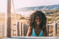 Beautiful young black woman lying down in a wooden foot bridge Royalty Free Stock Photo