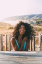 Beautiful young black woman lying down in a wooden foot bridge Royalty Free Stock Photo