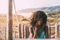 Beautiful young black woman lying down in a wooden foot bridge Royalty Free Stock Photo