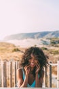 Beautiful young black woman lying down in a wooden foot bridge Royalty Free Stock Photo