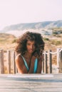 Beautiful young black woman lying down in a wooden foot bridge Royalty Free Stock Photo