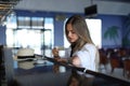Beautiful young blond drinking coffee. attractive girl sitting in cafe. Relaxing. Summer vacation. Summertime. Royalty Free Stock Photo