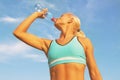 Beautiful young blond girl drinking water Royalty Free Stock Photo