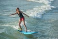 Young girl on a surf board