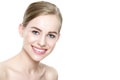 Beautiful young blond smiling woman with clean skin, natural make-up and perfect white teeth Royalty Free Stock Photo