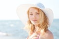 Beautiful young blond woman with beach hat Royalty Free Stock Photo