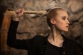 Beautiful young blond woman drinks wine in wine cellar Royalty Free Stock Photo