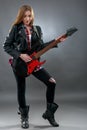 Beautiful young,blond woman with a electric guitar Royalty Free Stock Photo