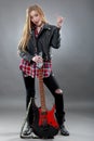 Beautiful young,blond woman with a electric guitar Royalty Free Stock Photo