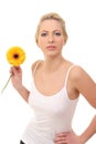 young blond woman with a flower in her hands Royalty Free Stock Photo