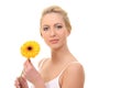 young blond woman with a flower in her hands Royalty Free Stock Photo