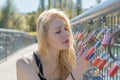 Beautiful young blond woman holding padlocks Royalty Free Stock Photo