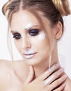 Blond woman with sparkling silver makeup