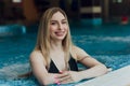 Beautiful young blond woman at swimming pool. Royalty Free Stock Photo