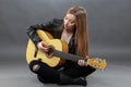 A beautiful young blonde with a classical guitar Royalty Free Stock Photo