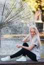 Beautiful young blonde girl with a pretty face and beautiful smiling eyes. Portrait of a woman with long hair and amazing looks. Royalty Free Stock Photo