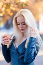 Beautiful young blonde girl with a pretty face and beautiful smiling eyes. Portrait of a woman with long hair and amazing looks. Royalty Free Stock Photo