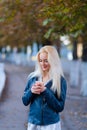 Beautiful young blonde girl with a pretty face and beautiful smiling eyes. Portrait of a woman with long hair and amazing looks. Royalty Free Stock Photo