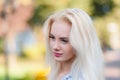 Beautiful young blonde girl with a pretty face and beautiful smiling eyes. Portrait of a woman with long hair and amazing look. Royalty Free Stock Photo