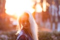 Beautiful young blonde girl with a pretty smiling face and beautiful eyes. A woman with long hair dispels their, amazing looks Royalty Free Stock Photo