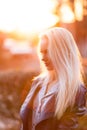 Beautiful young blonde girl with a pretty smiling face and beautiful eyes. A woman with long hair dispels their, amazing looks. Royalty Free Stock Photo