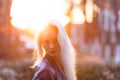 Beautiful young blonde girl with a pretty smiling face and beautiful eyes. A woman with long hair dispels their, amazing looks. Royalty Free Stock Photo