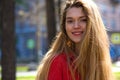 Beautiful young blonde girl in red blouse. Street fashion look Royalty Free Stock Photo