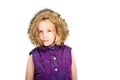 Beautiful young blonde girl wearing a fur lined hood on a white studio background Royalty Free Stock Photo