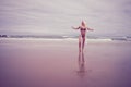 Beautiful young blonde haired woman on the beach in bikini Royalty Free Stock Photo