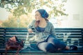 Beautiful young blonde hipster woman listening music Royalty Free Stock Photo