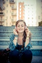 Beautiful young blonde hipster woman listening music Royalty Free Stock Photo