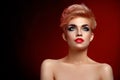 Beautiful young blonde red lipped woman posing in artistic red l Royalty Free Stock Photo