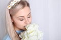 Beautiful young blonde woman with clean skin and flowers Royalty Free Stock Photo