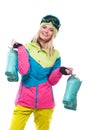 Beautiful young blonde woman in colorful snow coat hold snow boo Royalty Free Stock Photo