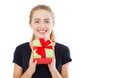 Beautiful young blonde woman holding gift over isolated background with surprise face pointing finger to himself,copy space Royalty Free Stock Photo